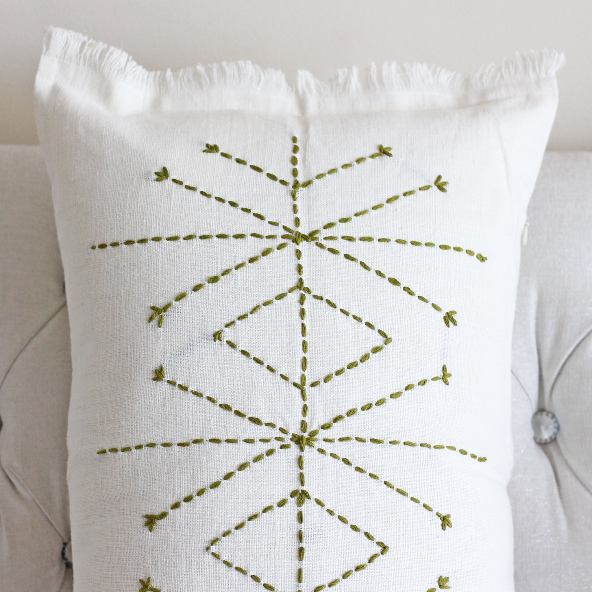 http://www.kuttons.com/cdn/shop/products/Hand_Embroidered_Linen_Gauze_Pillow_Cover_-_Fringed_Edges_Green_Embriodery_-_3.jpg?v=1652284719