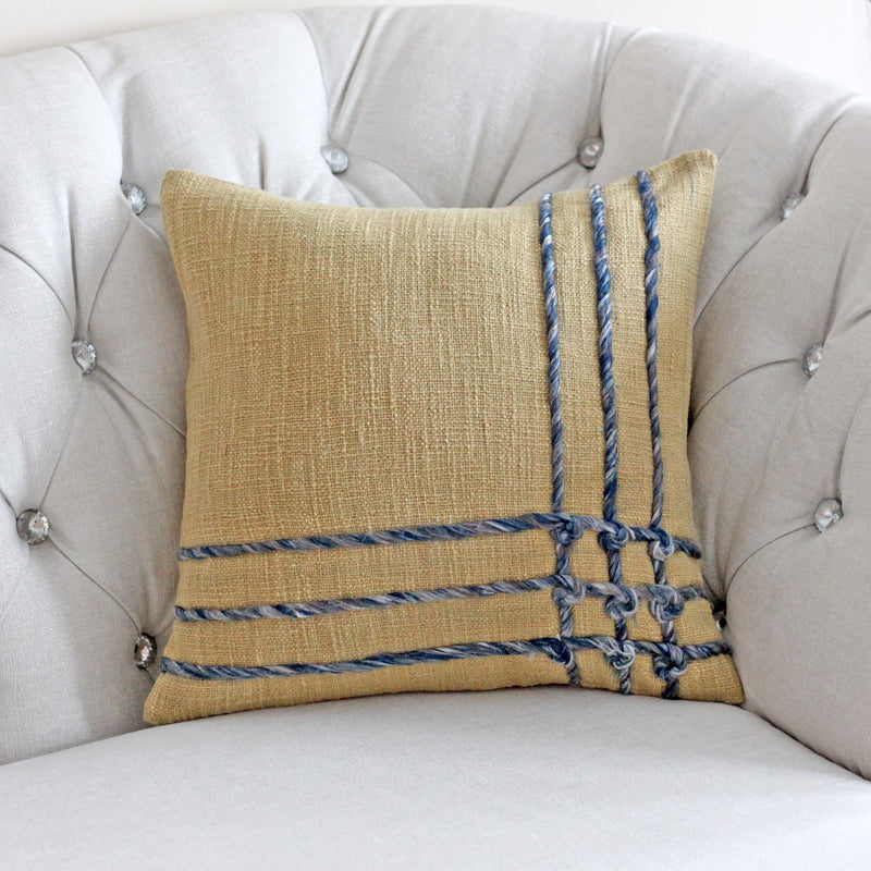 https://www.kuttons.com/cdn/shop/products/JuteCottonPillowCover-EmbellishedwithTwillGreyishBraids_Mustard_16inch-1_800x.jpg?v=1653873351